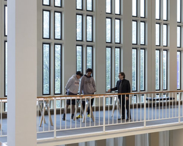 Curator Robert Shane chatting with museum visitors