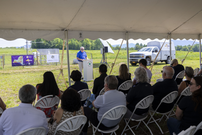 James McKenna, board member of the Uihlein Foundation, offers welcome remarks to attendees in front of the Lake Placid Mesonet site.