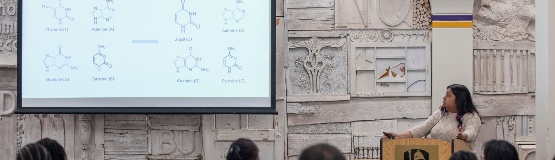 Health disparities doctoral fellow Esperanza Rosas presents a slide titled, "Canonical nucleotides can be modified," with images of RNA and DNA compounds.