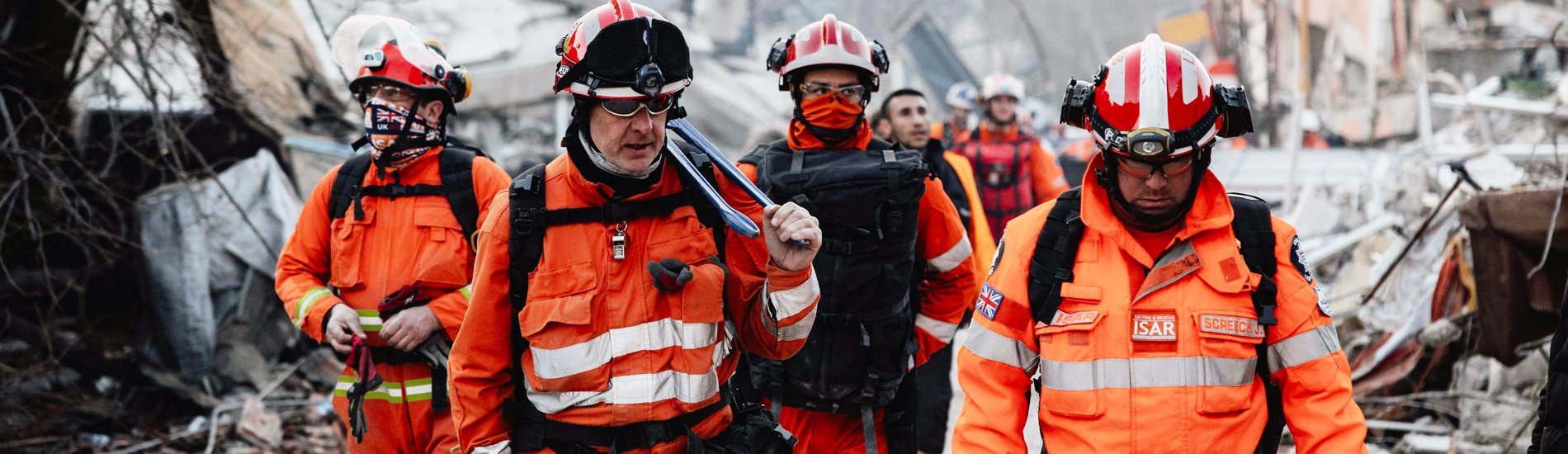 A group of emergency responders at a disaster site.