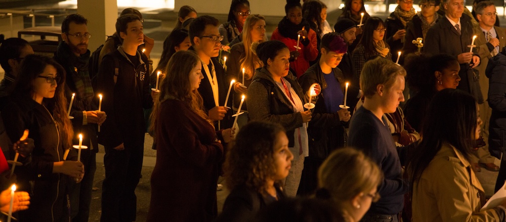 Group holds a candlelight vigil.